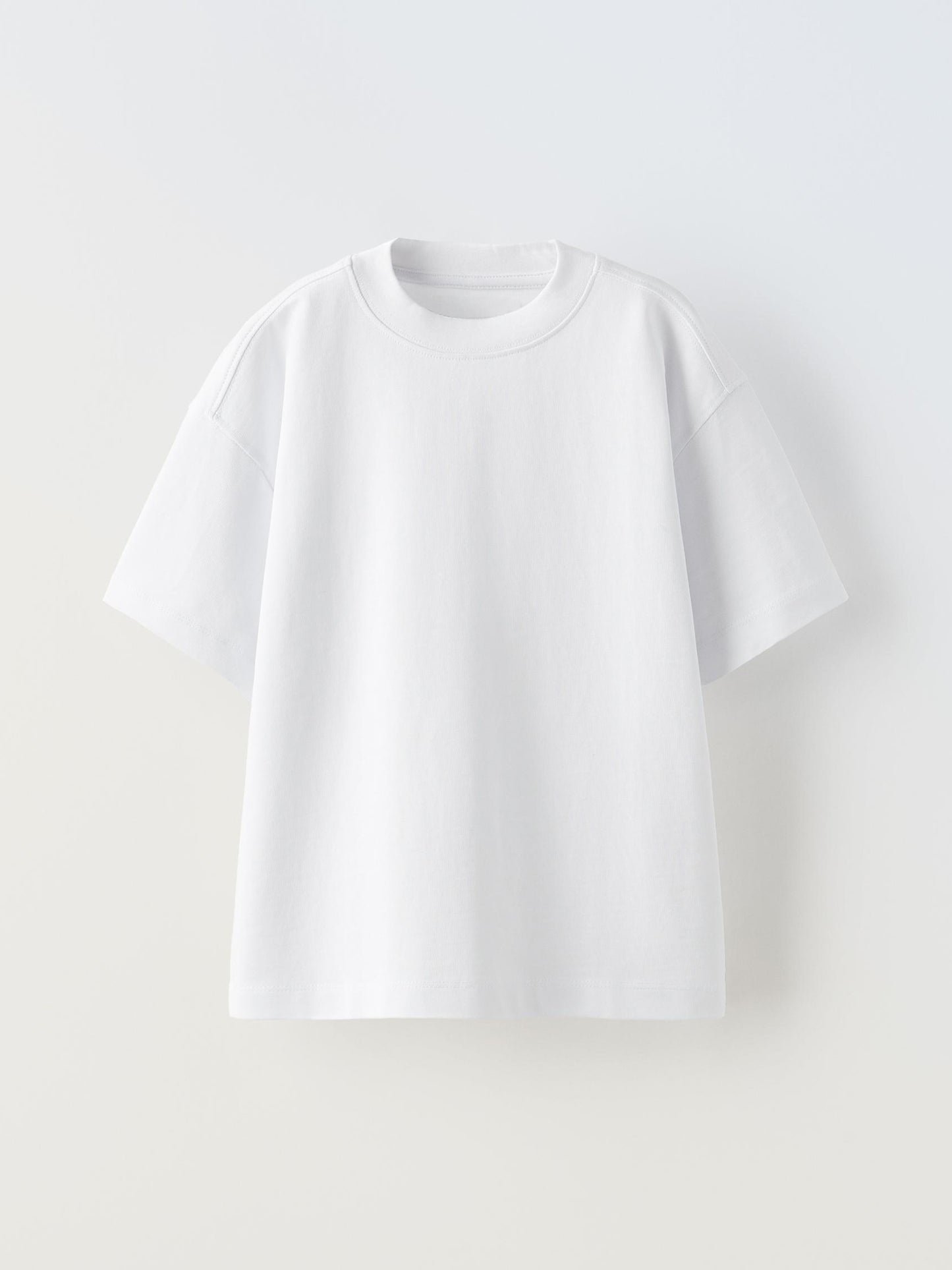 White oversized T-Shirt, with a clean white front.