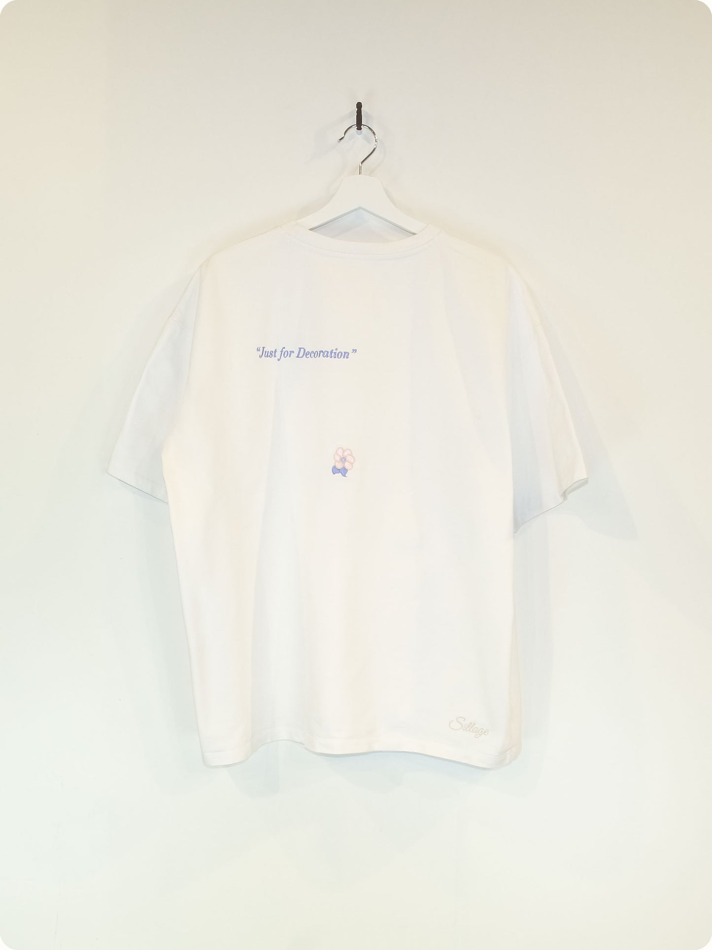 The Golden Twenties Shirt is a classic white Tee with high quality embroidery just on the back. The front of the Shirt is blank for maximum versatility.