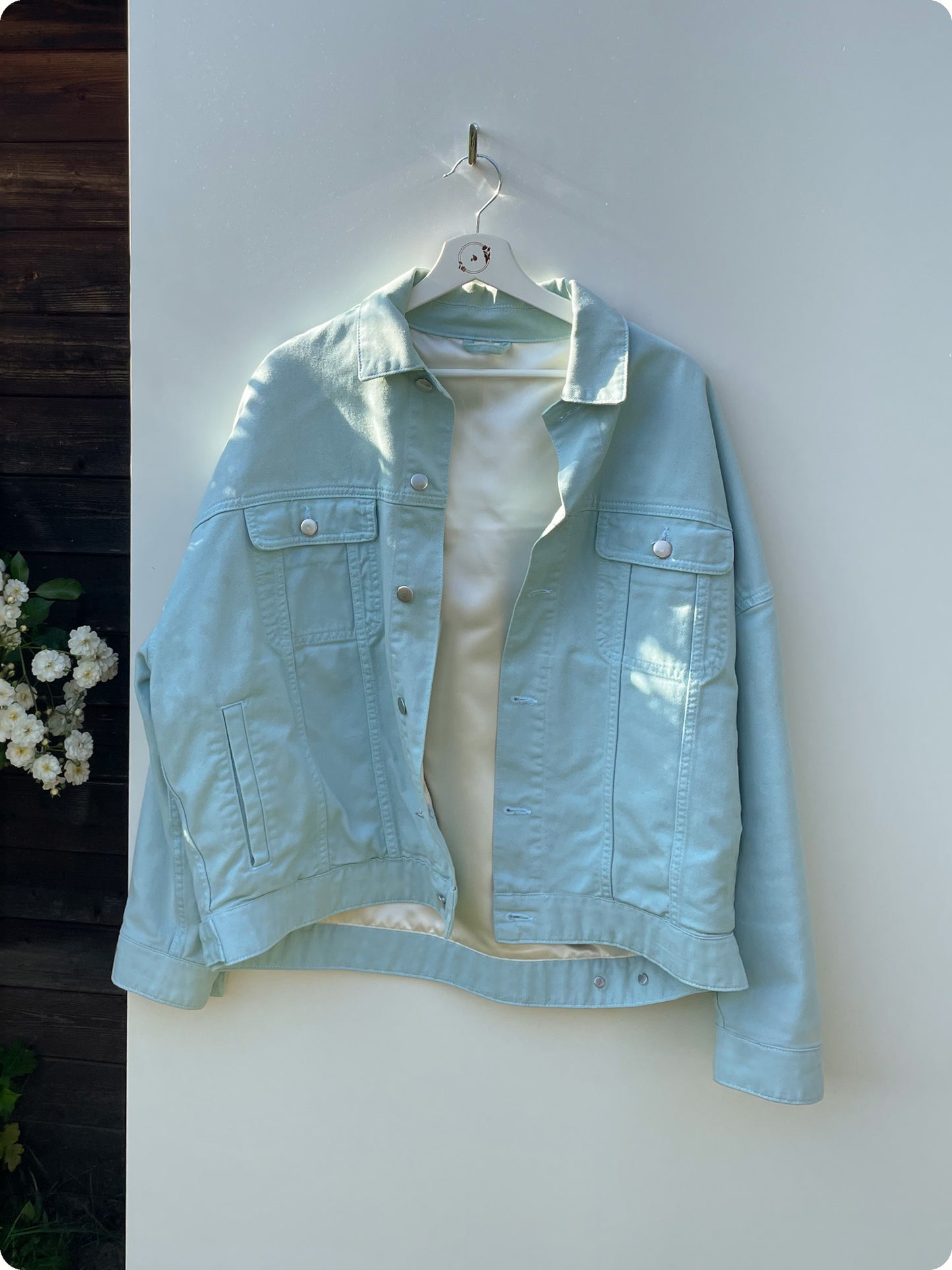 The Sillage Rose N Tears Denim Jacket is one of our best pieces. A minty blue Denim Fabric with shiny silver buttons. The Jackets unique feature is a silver gold satin lining on the inside that shimmers in the sun.