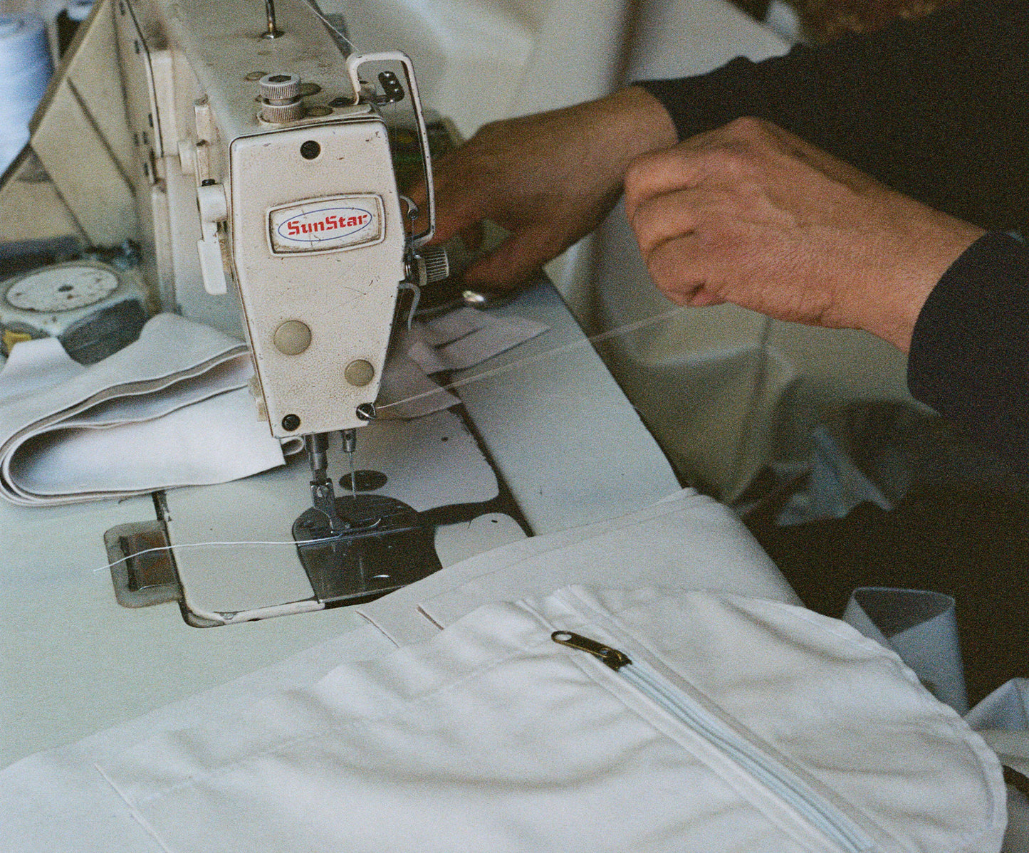 A moroccan artisan tailoring our classic Away Weekender from high-end velvet fabric