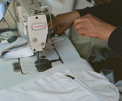 A moroccan artisan tailoring our classic Away Weekender from high-end velvet fabric